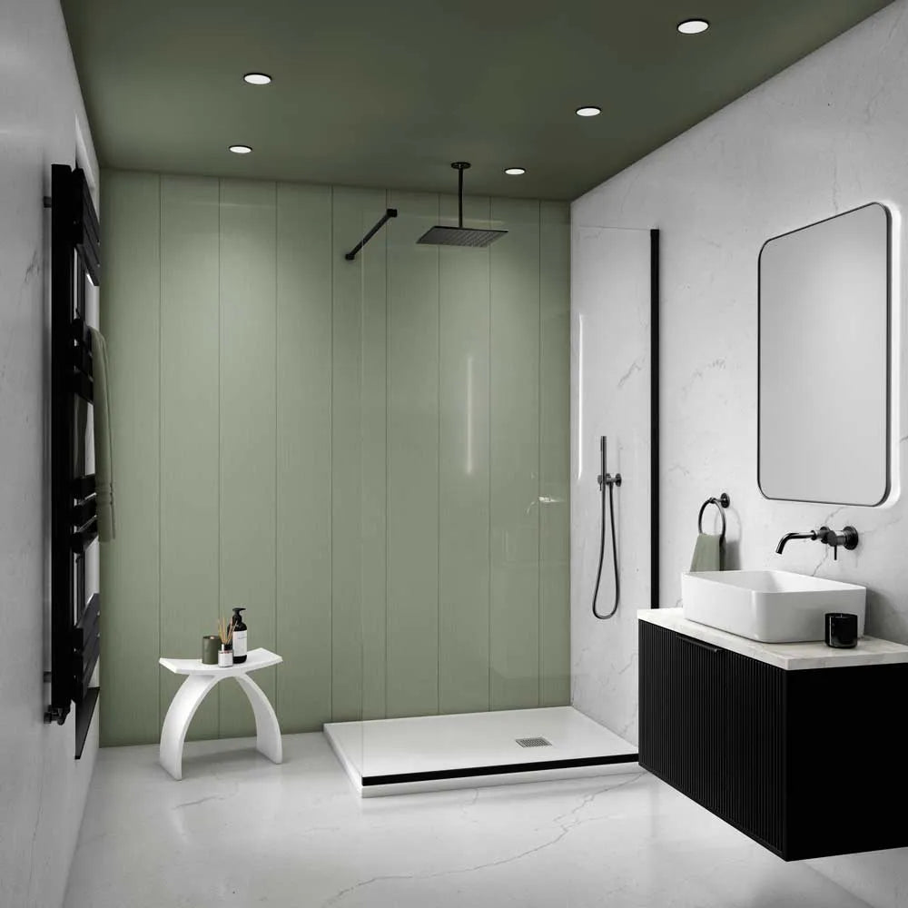 Modern bathroom interior with a sage green shower wall and ceiling, white marble-look floor and walls, a black floating vanity with a white vessel sink, a large rectangular mirror, and a black wall-mounted towel rail.