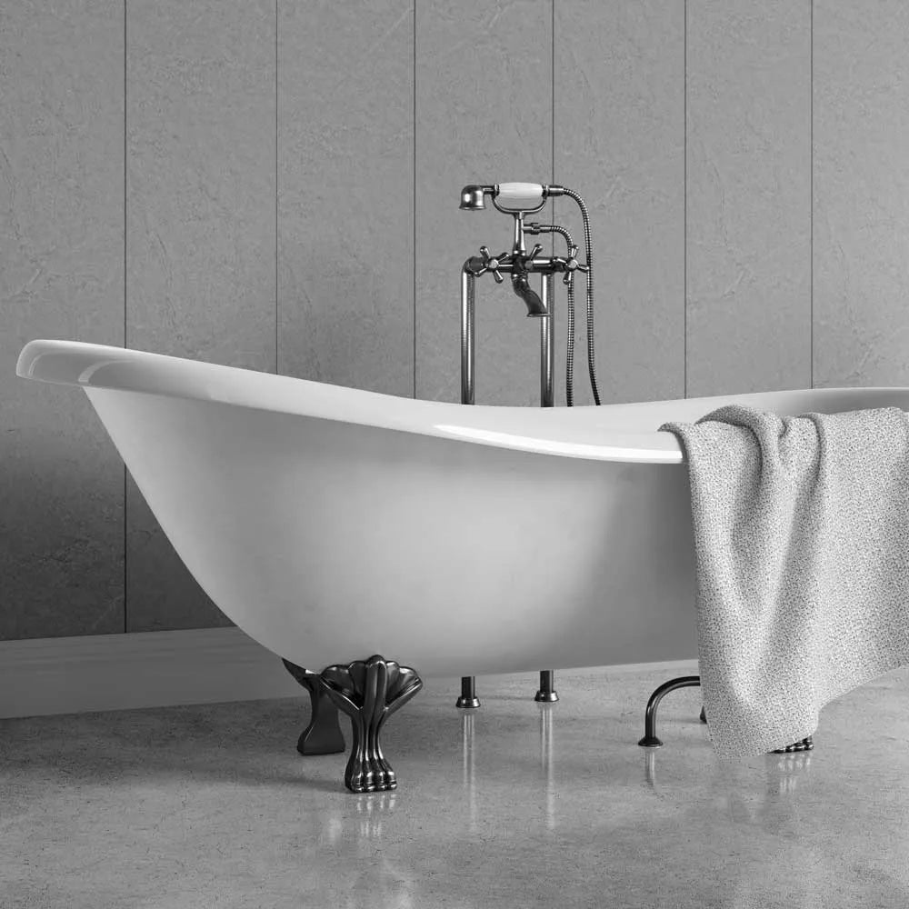 A freestanding clawfoot bathtub in white with dark metal legs, shown in a bathroom setting with a matching white towel draped over the side and a chrome faucet above.