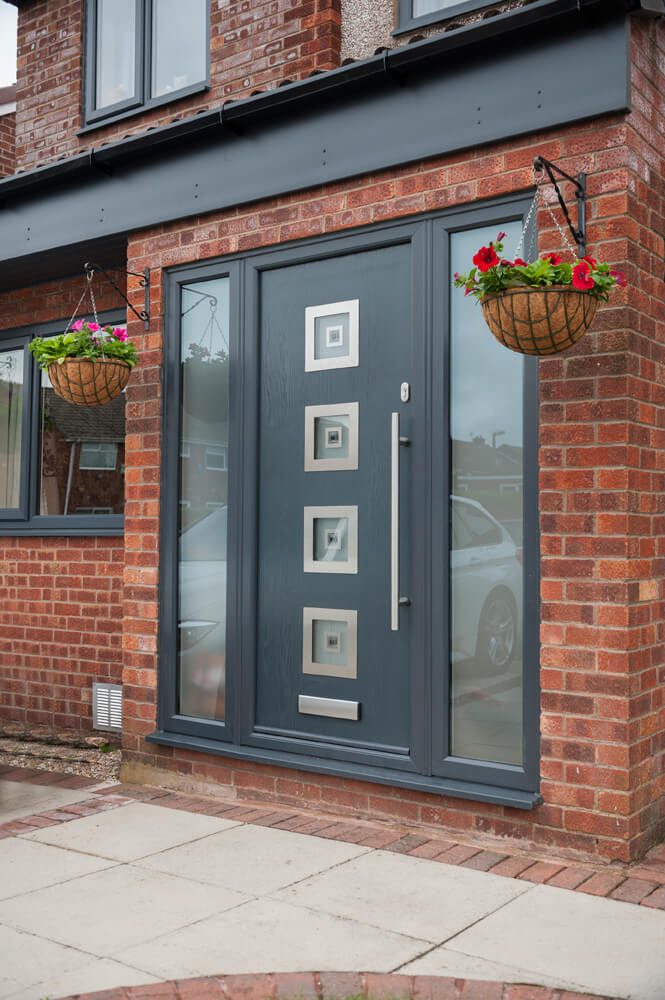 Modern composite door in anthracite grey with red brick