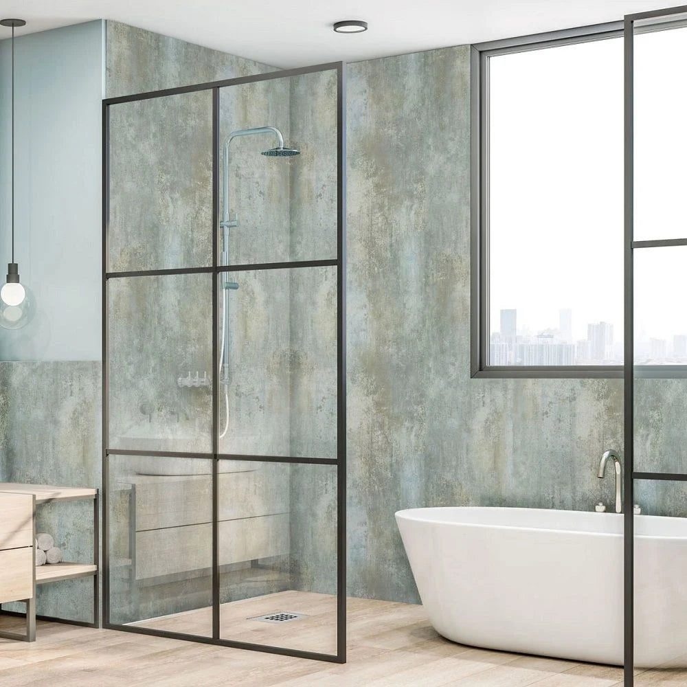 A modern glass shower enclosure with a black metal frame in a contemporary bathroom, shown alongside a freestanding white bathtub and textured walls.