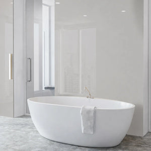 Modern bathroom with a freestanding white bathtub against a light gray wall.