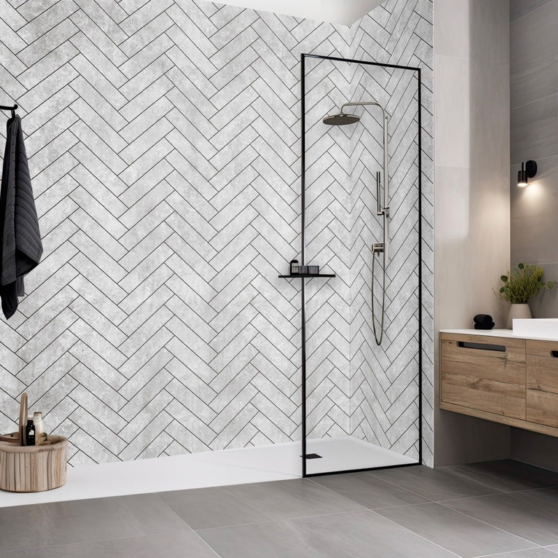 Modern bathroom with a shower area featuring a herringbone tile pattern. Cheveron grey internal wall panels 