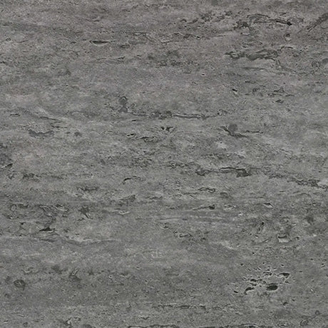 Close-up of a gray stone surface with a rough texture