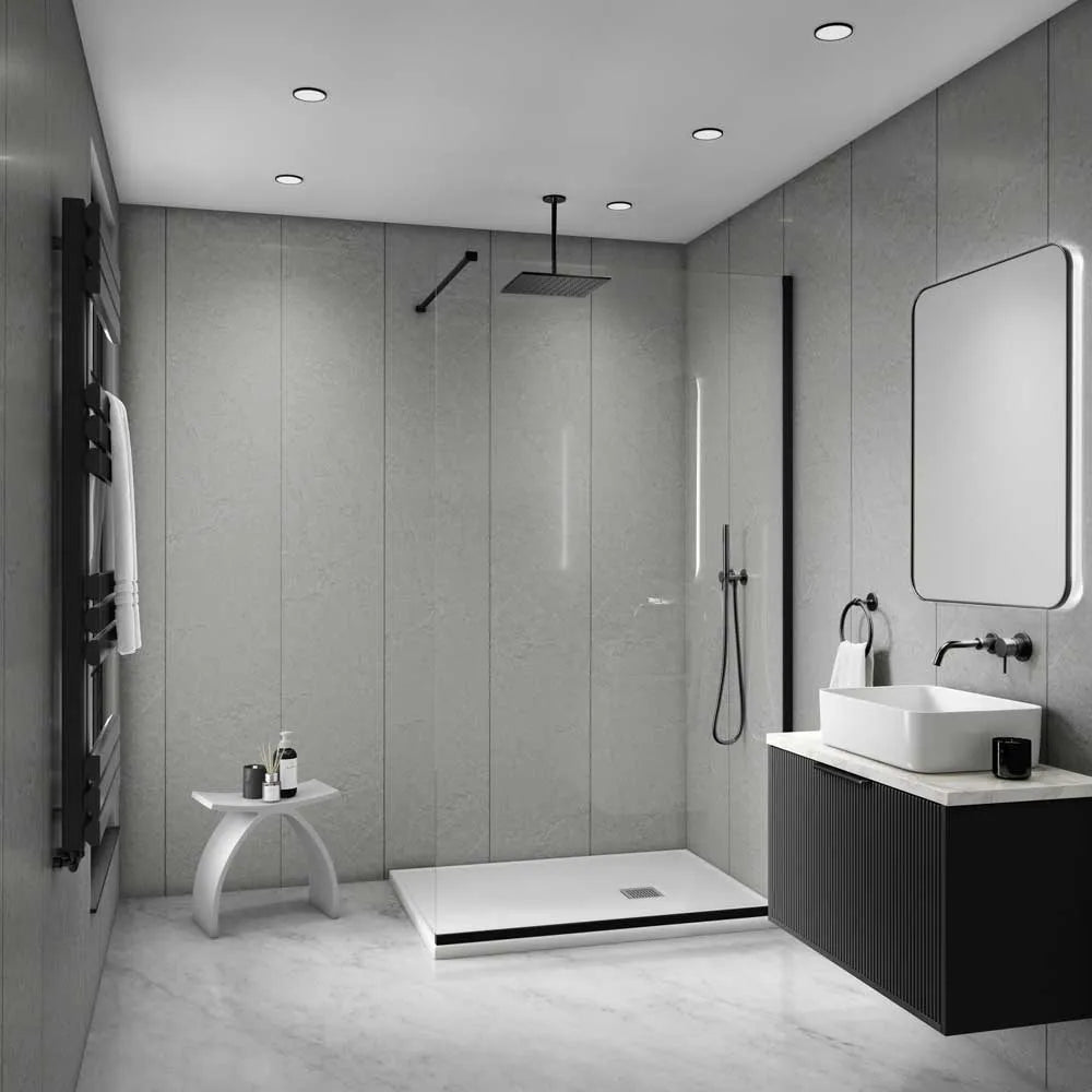 Modern bathroom interior with a walk-in shower enclosure, white vessel sink, dark floating vanity, large rectangular mirror, and gray stone-look walls and floor.