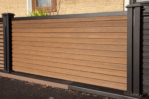 Composite fence with black Composite posts and railings.