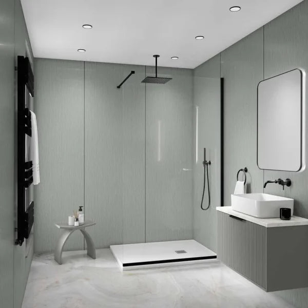A modern bathroom interior with a walk-in shower area, white vessel sink, wall-mounted vanity, large mirror, black fixtures, and pale gray textured walls and floor.