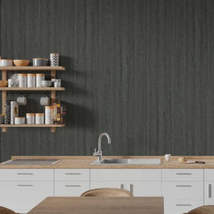 Dark charcoal gray wood-look wallpaper on a kitchen wall behind white cabinets, a light wood countertop, and floating wooden shelves with kitchenware.