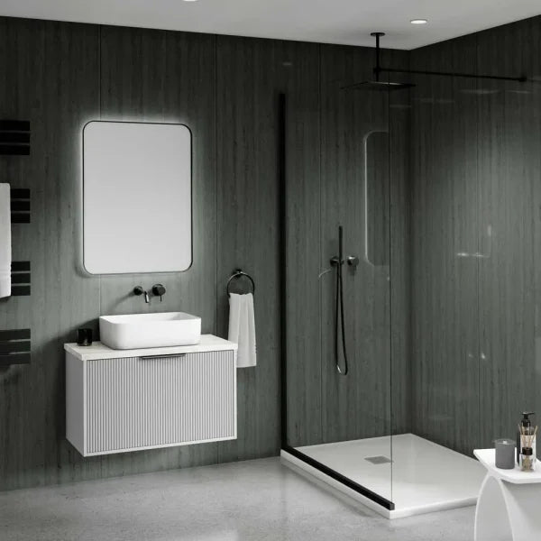 Modern bathroom interior with a floating white vanity, rectangular vessel sink, wall mirror, dark wood-look walls, a glass shower enclosure, and a white bathtub.