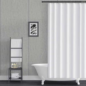 A white fabric shower curtain hanging from a black rod in a modern bathroom setting with a gray textured wall, a white clawfoot tub, and a black metal ladder shelf.