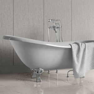 A freestanding oval bathtub with claw feet and a polished chrome faucet set, shown in a bathroom setting with a gray textured wall and marble-look floor. A gray towel is draped over the side of the tub.