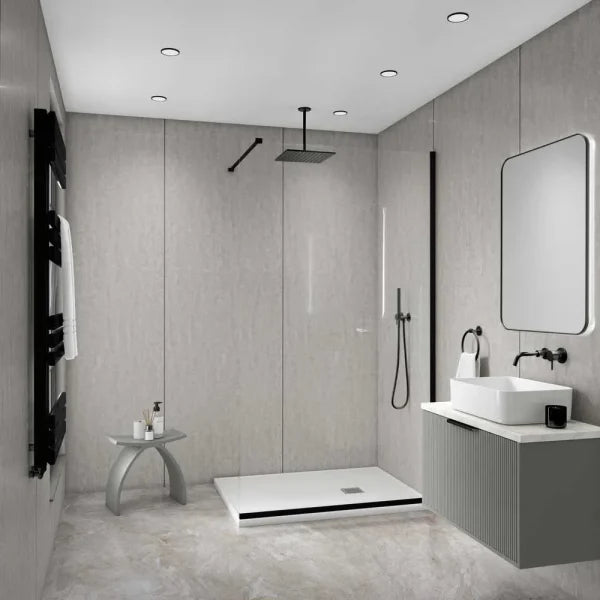 Modern bathroom interior with a walk-in shower area, white vessel sink, gray vanity, large mirror, black fixtures, and light stone walls and floor.