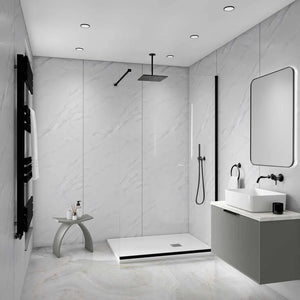 Modern bathroom interior with a walk-in shower area, white marble-look walls and floor, a white vessel sink, gray vanity, black fixtures, and a large rectangular mirror.
