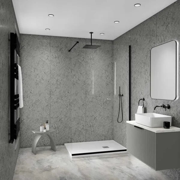 Modern bathroom interior with a walk-in shower area, white vessel sink, floating vanity, gray textured walls, and recessed ceiling lights.