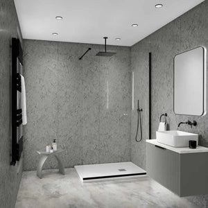 Modern bathroom interior with a walk-in shower area, white vessel sink, floating vanity, gray textured walls, and recessed ceiling lights.