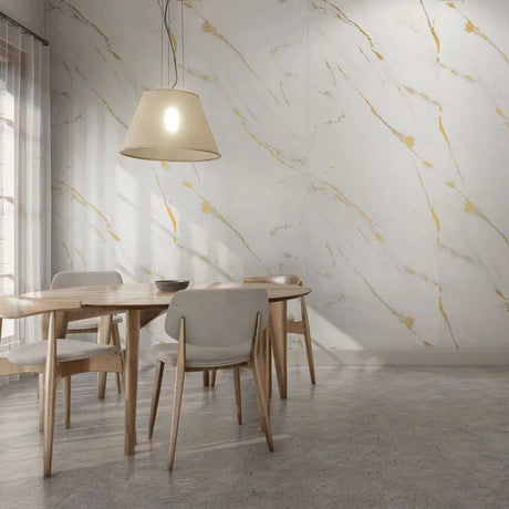Dining room with wooden table and chairs against a marble-patterned wall.