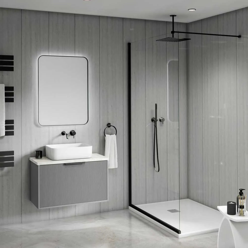 Modern bathroom interior with a floating gray vanity, white vessel sink, rectangular mirror, black fixtures, and a glass shower enclosure with black trim.