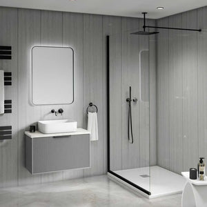 Modern bathroom interior with a floating gray vanity, white vessel sink, rectangular mirror, black fixtures, and a glass shower enclosure with black trim.