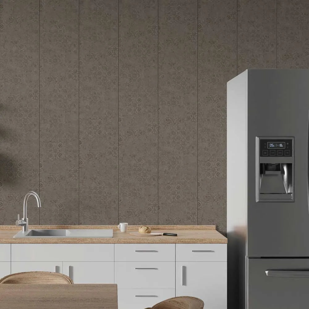 A modern kitchen scene featuring a large stainless steel refrigerator on the right, white lower cabinets with a light wood countertop and sink on the left, and a textured gray damask-patterned wall behind.