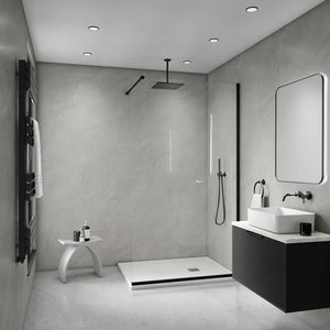Modern bathroom interior with a walk-in shower enclosure, white vessel sink, dark floating vanity, wall-mounted mirror, black towel rail, and gray stone-look walls and floor.