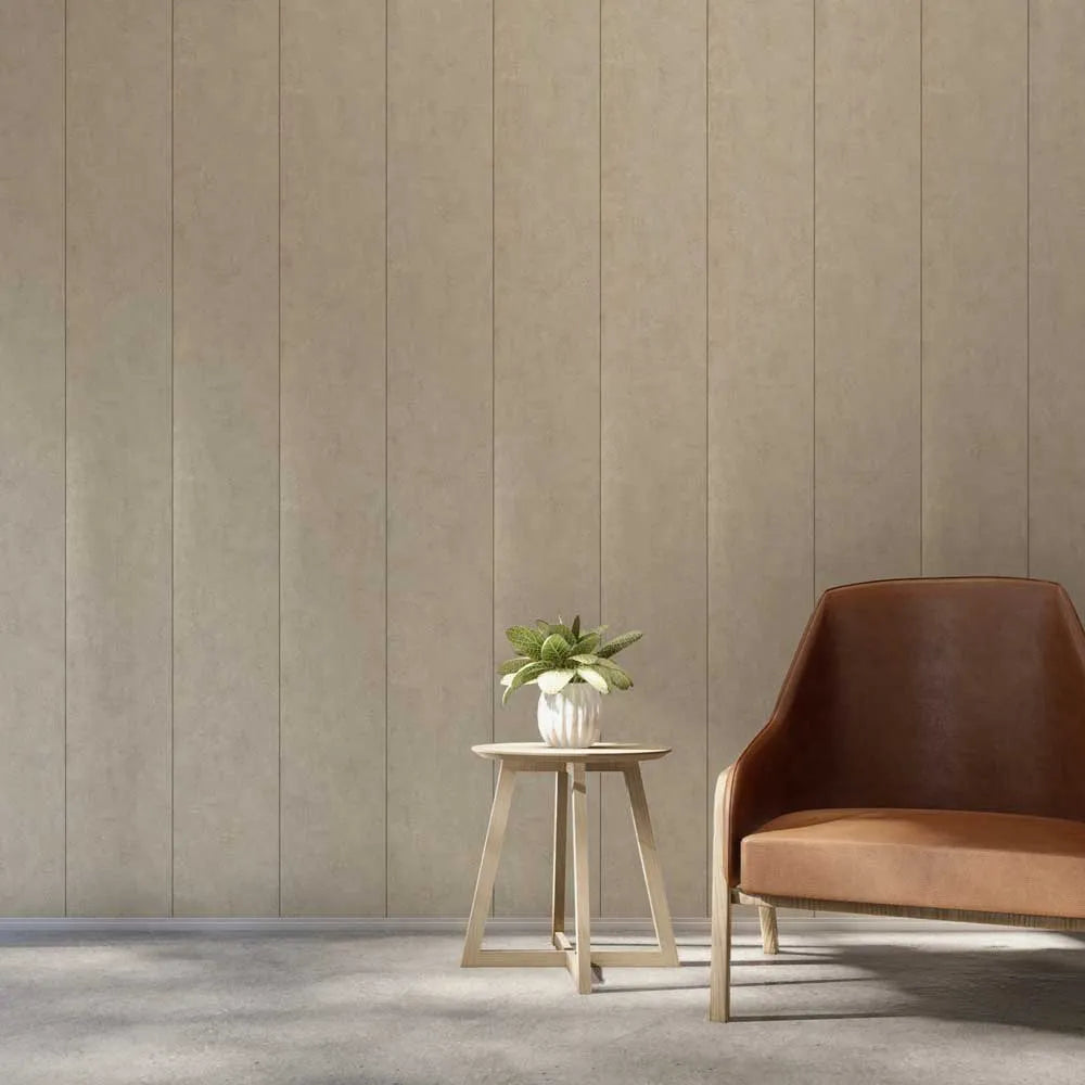 A modern interior scene with a brown leather armchair next to a small wooden side table holding a potted green plant, set against a beige vertically paneled wall and gray floor.