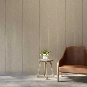 A modern interior scene with a brown leather armchair next to a small wooden side table holding a potted green plant, set against a beige vertically paneled wall and gray floor.