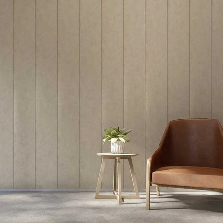 A modern interior scene with a brown leather armchair next to a small wooden side table holding a potted green plant, set against a beige vertically paneled wall and gray floor.