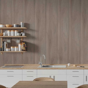 A modern kitchen scene with white cabinets, a light wood countertop, a stainless steel sink and faucet, open wooden shelves with jars and books, and a wood-look wall paneling.