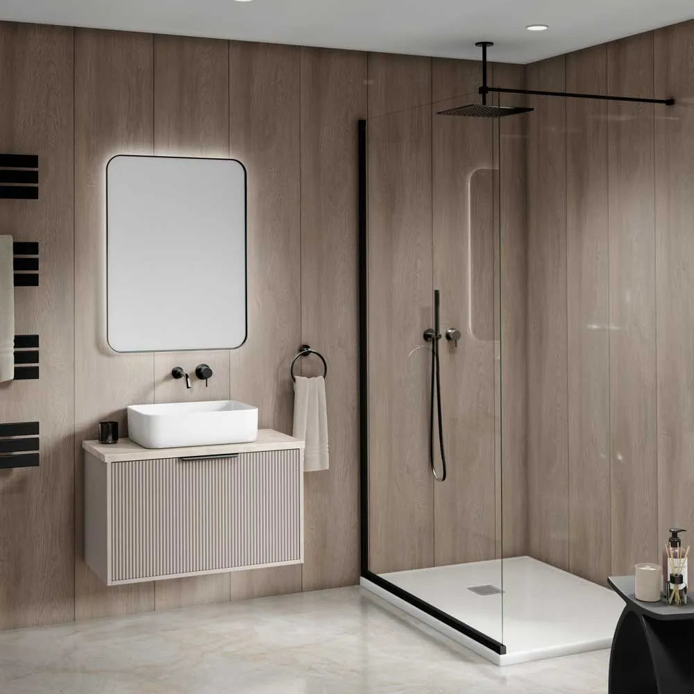 Modern bathroom interior featuring a floating vanity with a white vessel sink, a large rectangular mirror, and a walk-in shower with clear glass doors and black trim.