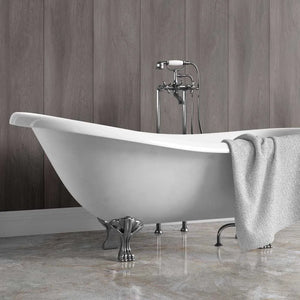 White freestanding bathtub with a gray towel against a carbon woodgrain upvc wall.