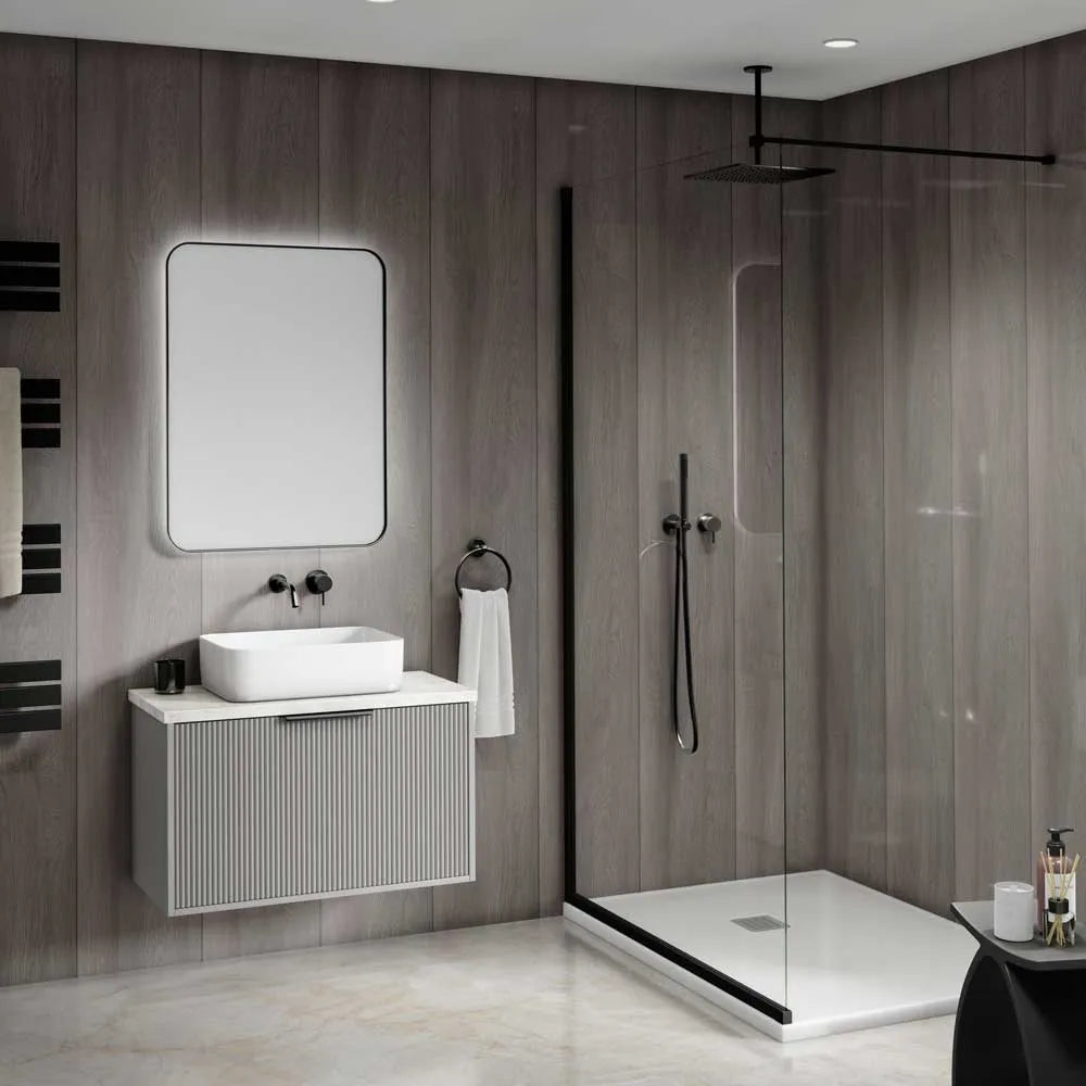 Modern bathroom interior featuring a floating white vanity with a rectangular vessel sink, a large rectangular mirror, and a walk-in shower with clear glass doors and black trim.