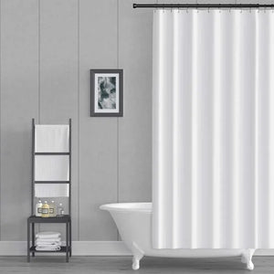 A white fabric shower curtain hanging from a black rod in a modern bathroom setting with a white clawfoot tub, a gray paneled wall, and a small black shelving unit.