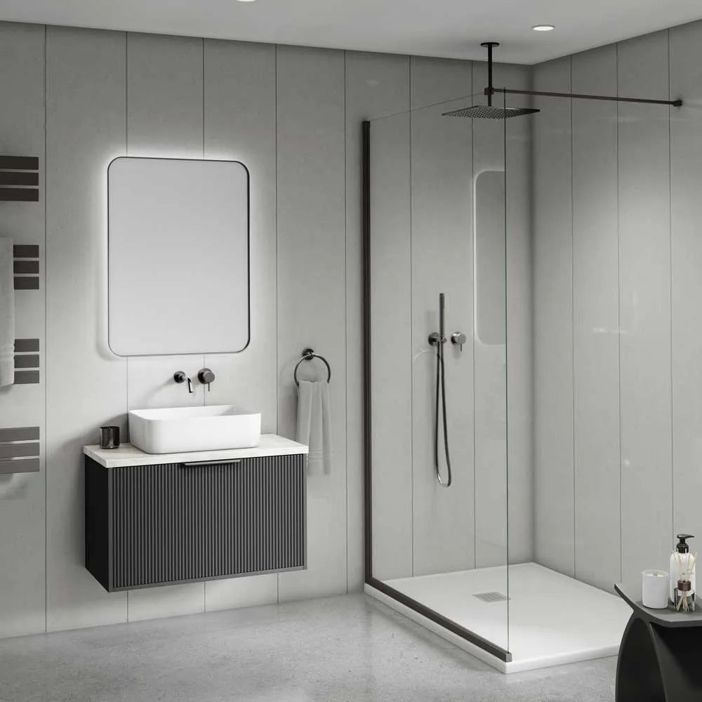 Modern bathroom interior with a floating dark gray vessel sink cabinet, white rectangular basin, illuminated rectangular mirror, glass shower door, and a rain shower overhead.