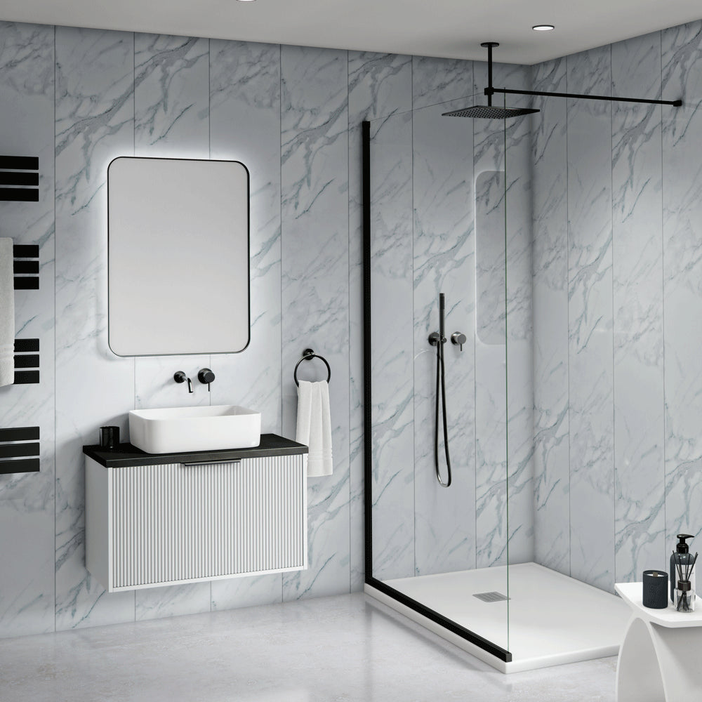 Modern bathroom interior with a floating white vanity, rectangular basin, large mirror, black faucet hardware, a glass shower door, black shower rail, and light gray marble-look wall and floor tiles.