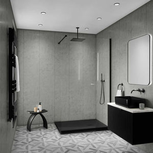 Modern bathroom interior with a walk-in shower area, black vessel sink, white countertop, gray textured walls, patterned floor, and a large rectangular mirror.