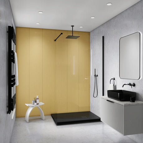 Modern bathroom interior with a large mustard-yellow wall panel behind a walk-in shower area, gray textured walls, a black shower head and floor tray, a white vanity with a black sink, and a rectangular mirror.