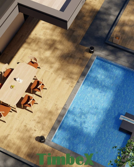 TimbeX wood-effect composite decking installed beside an outdoor swimming pool