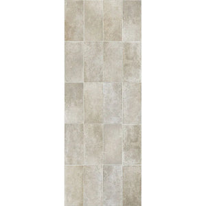 A vertical rectangular sample of light beige stone-look tiles with subtle gray and warm taupe variation, shown against a plain white background.