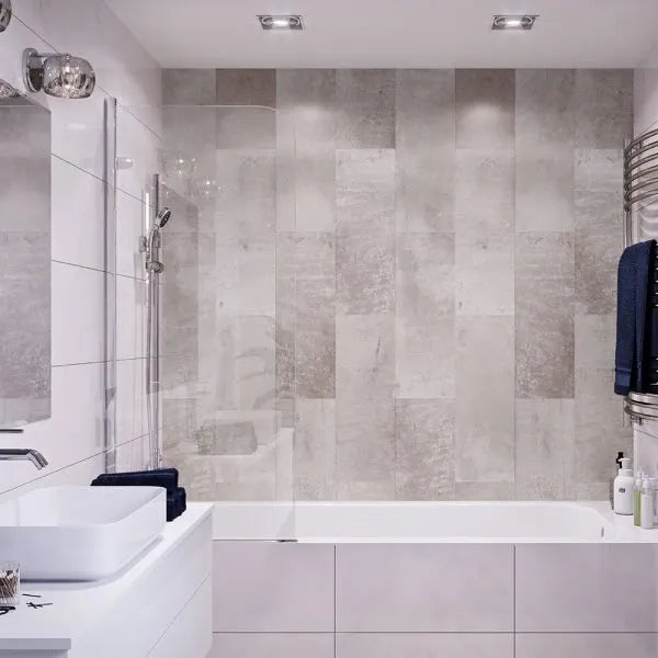 Modern bathroom with tiled walls, a bathtub, and sink.