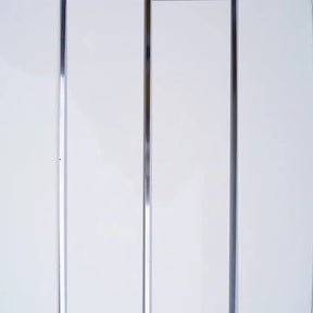 A close-up of a white panel door with two vertical metallic chrome or silver-colored frames running down the center.