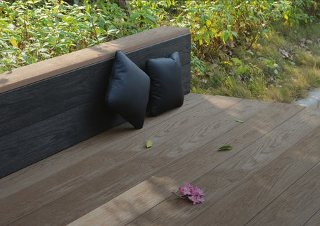 Marine Teak TimbeX XL composite decking beside a landscaped garden border
