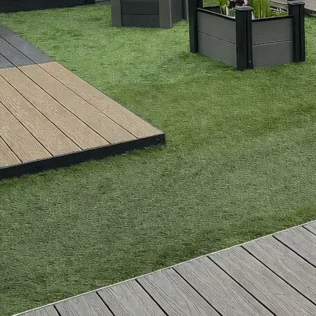 Artificial grass with composite decking in a garden setting