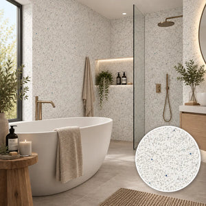 A modern bathroom interior featuring speckled light gray and white terrazzo-look wall tiles, a white freestanding bathtub, a glass shower enclosure, and a circular inset showing a close-up of the tile pattern.