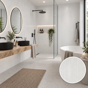 A modern bathroom interior with a freestanding white bathtub, double black vessel sinks on a wood countertop, round mirrors, a glass shower enclosure, and a woven bath rug. A circular inset at the bottom right shows a close-up of the bathtub's white textured finish.