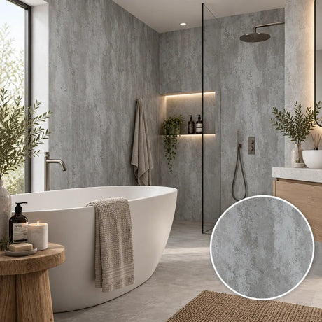 A modern bathroom interior with a freestanding white bathtub, glass shower enclosure, textured gray walls and floor, and a circular inset showing a close-up of the gray surface material.